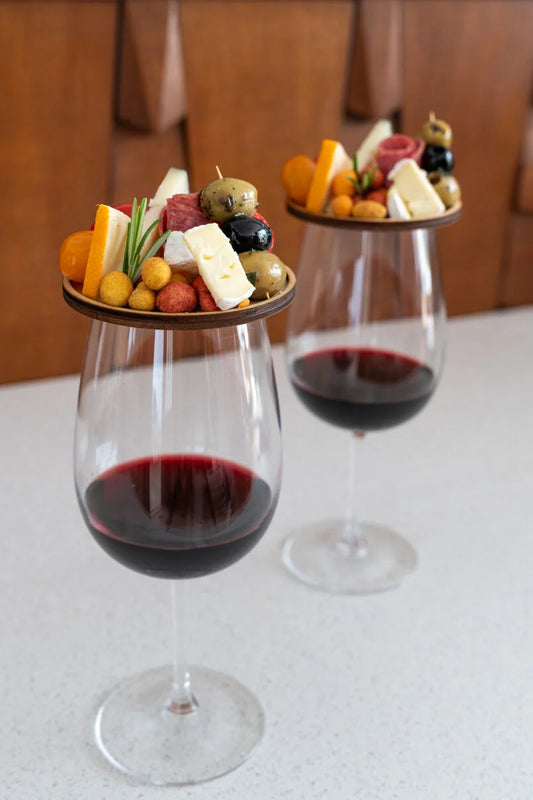 Charcuterie board topper on wine glass